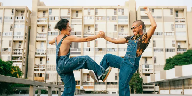 two friends dancing outside