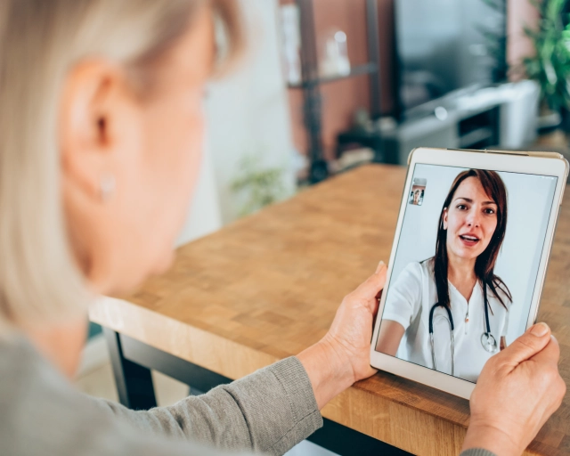 woman talking to virtual doctor