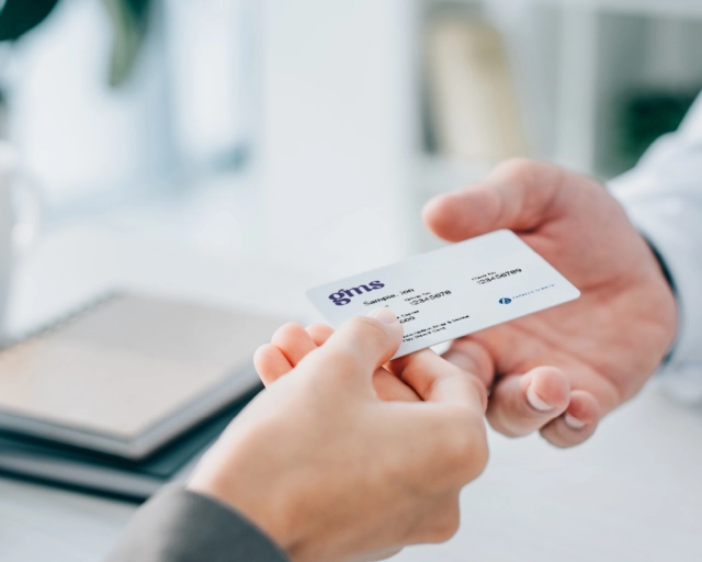 person showing pay direct card at pharmacy