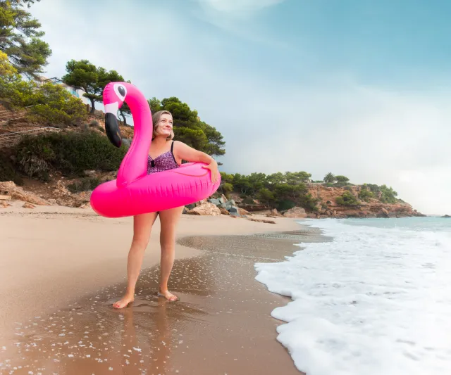 Woman on Beach Flamingo Floaty